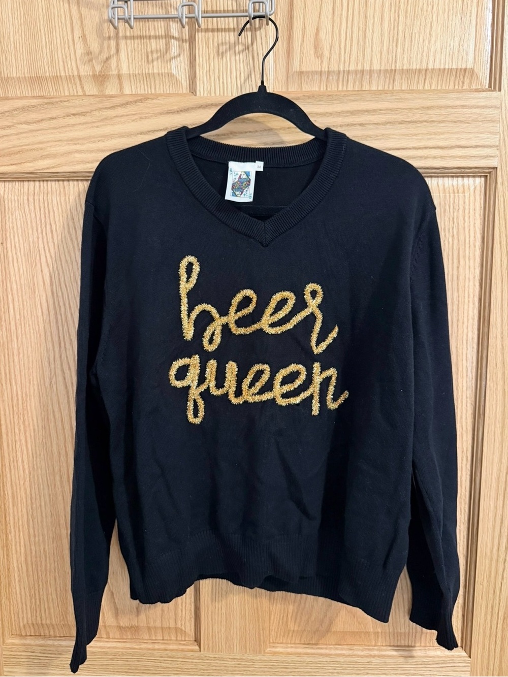 QUEEN OF SPARKLES Black V-Neck Sweater with Gold Script